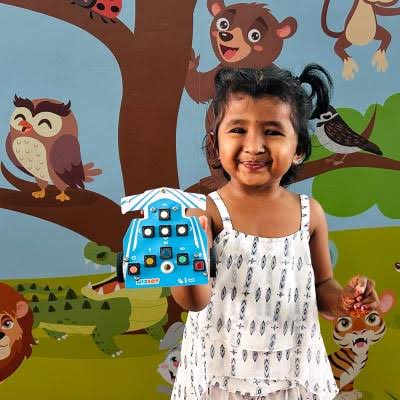 Child holding the Wizbot Neo device
